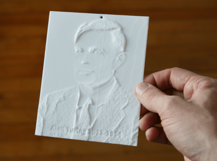 Alan Turing Shadowgram 3d printed Photo of the print lit from the front, revealing the relief
