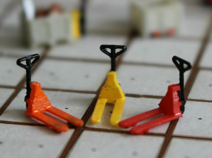 N Scale Pallet Jack (6pc) 3d printed 3 pallet jacks in Frosted Ultra Detail in different colors.