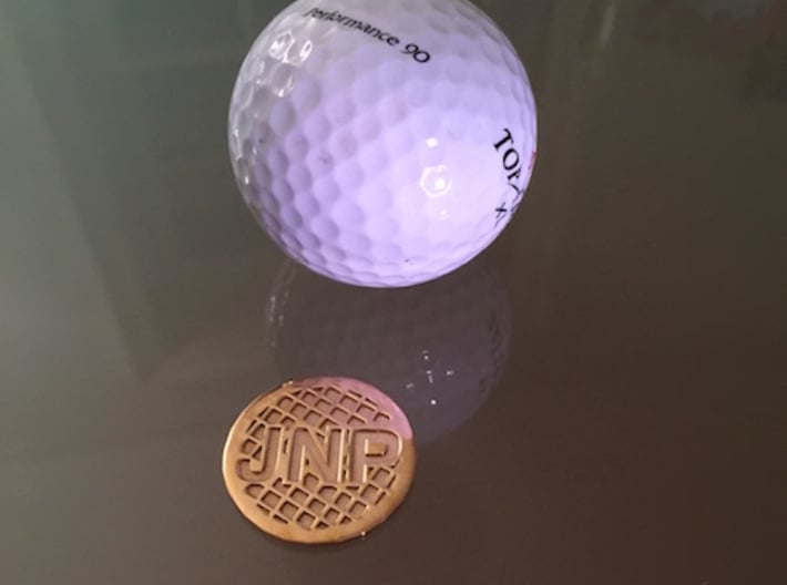 Personalized Golf Ball Marker 3d printed The design resembles the dimples of a golf ball.
