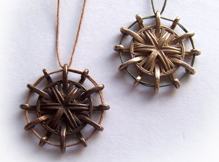 Tentacle Rosette Pendant 3d printed In stainless steel and antique bronze glossy.
