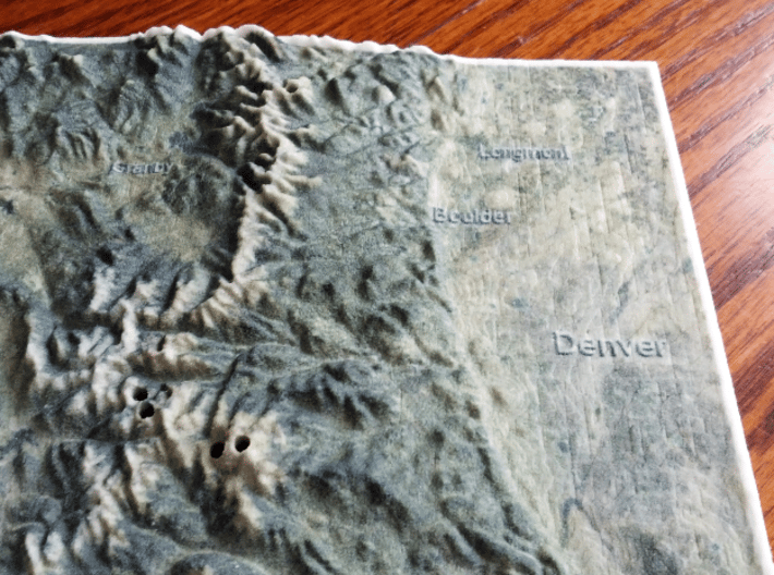 Colorado Fourteeners with holes, 12'' 3d printed Photo of actual print, focusing on Denver area; note holes for Mt Evans and Bierstadt in the lower-middle area