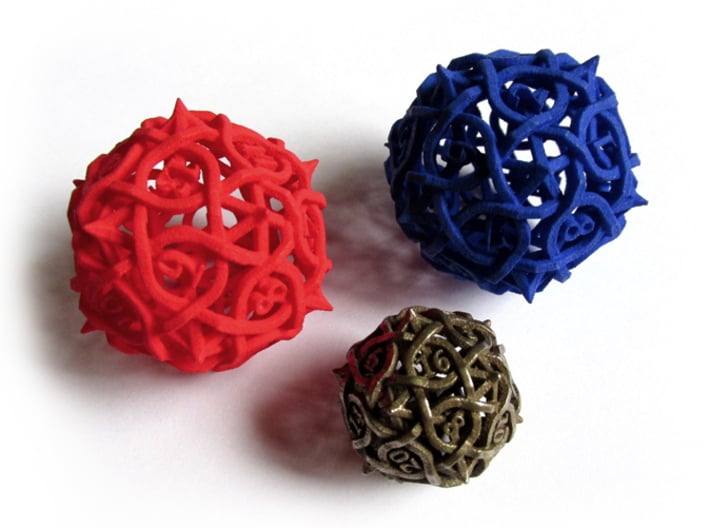 Spindown Thorn d20 3d printed Size comparison between the Spindown Thorn Die20 (in red and blue) and a normal Thorn Die20 (in stainless)