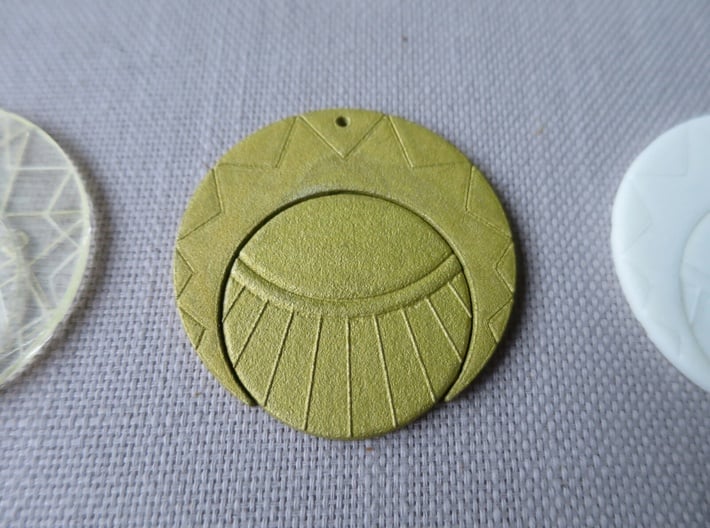 Estaban and Zia's Medallion from The Mysterious Ci 3d printed The back of the painted medallion.