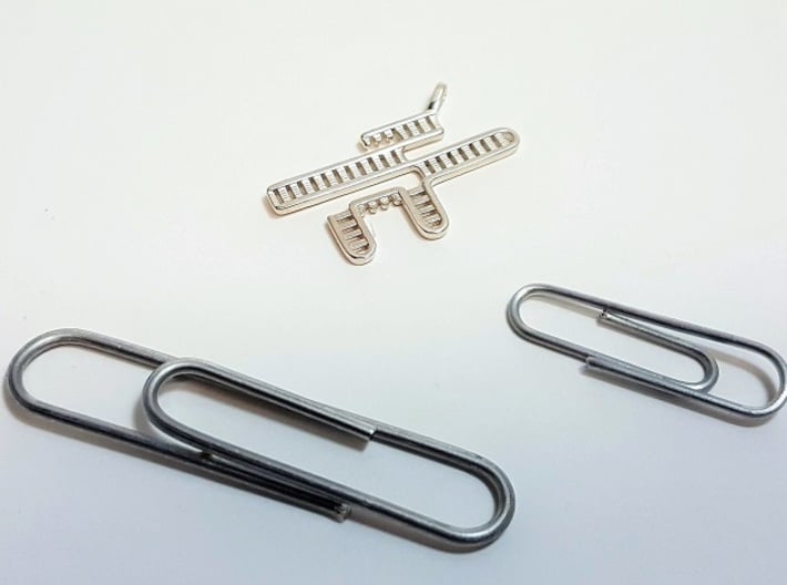 CRISPR RNA Pendant with Bail 3d printed Size comparison between two paper clips and the polished silver pendant