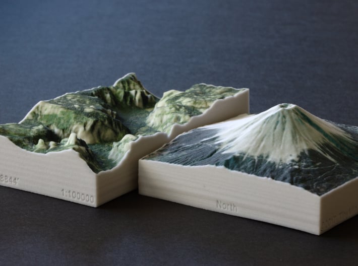 Mt. Fuji, Japan, 1:100000 Explorer 3d printed Mt Fuji model next to Yosemite Valley, both in the same scale