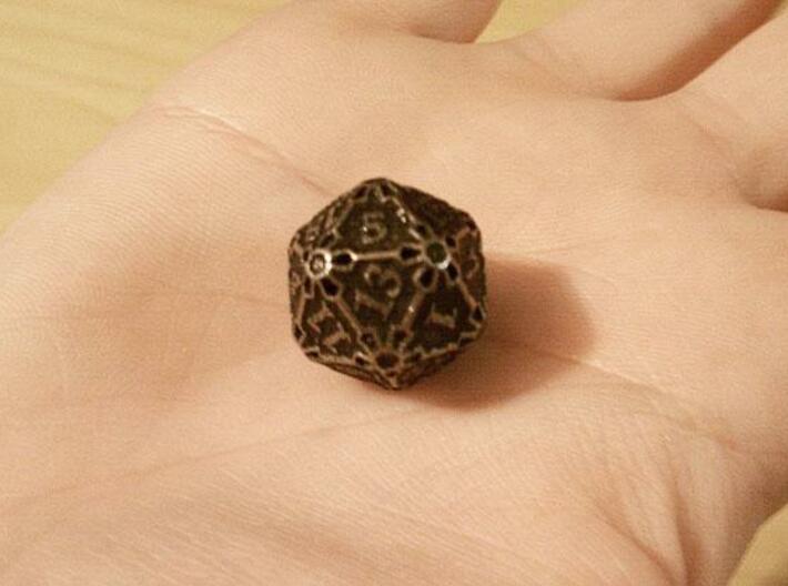 Premier d20 3d printed In stainless steel and inked.
