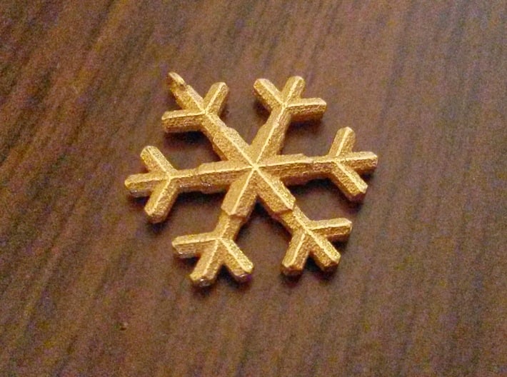 A wee snowflake pendant 3d printed Snowflake in polished gold steel
