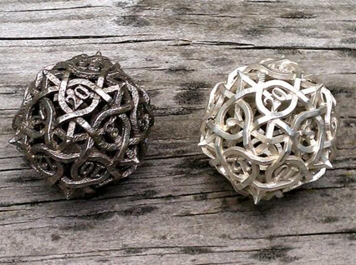Interwoven Geometric Vines and Thorns D20 3d printed In stainless steel vs silver.
