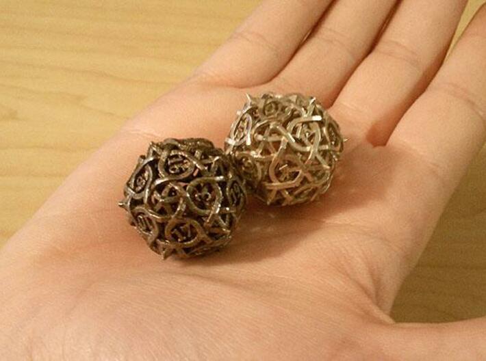 Interwoven Geometric Vines and Thorns D20 3d printed In stainless steel and silver.