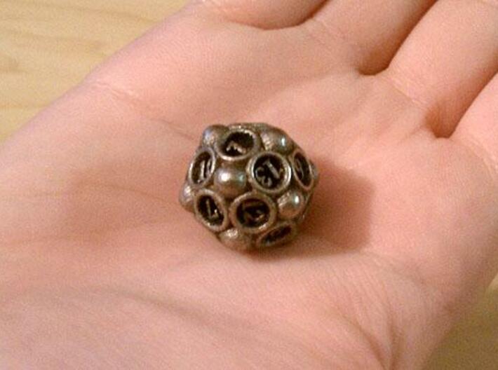 Spore d20 3d printed In stainless steel and inked.
