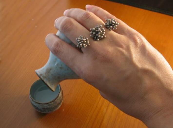 Triple Starburst Ring 3d printed steel on hand
