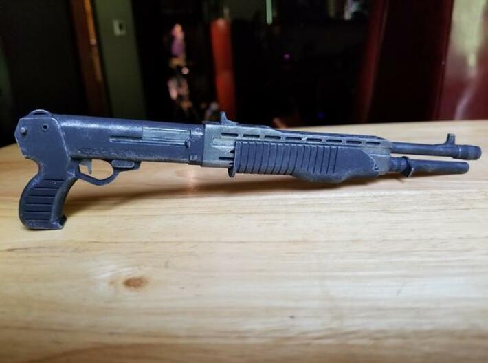 SPAS 12 1:6 scale shotgun with moveable pump 3d printed SPAS-12 model in frosted ultra detail, hand painted.  Size shown is 1:4 scale. 