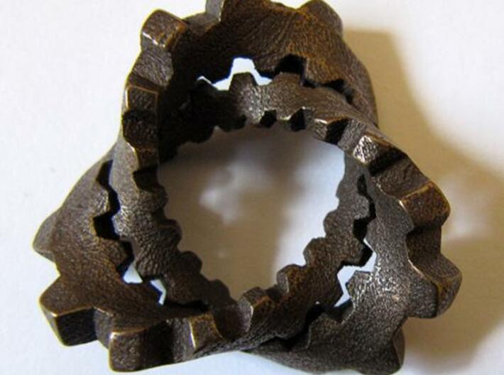 Trefoil with Cogs 3d printed Stainless steel with "antique bronze glossy" finish.