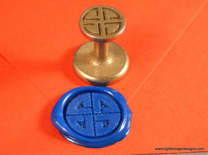 Shield Knot Wax Seal 3d printed Same as the first one, with Royal Blue wax on an orange envelope.