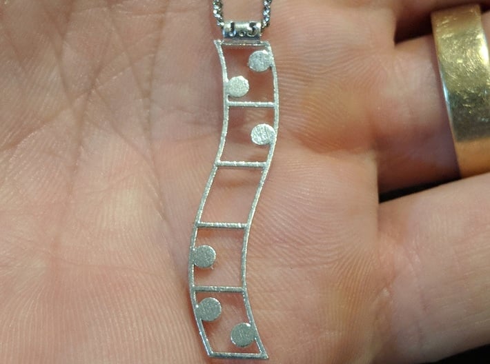 Palindrome Pendant 3d printed Pictured is an older model with a smaller top loop