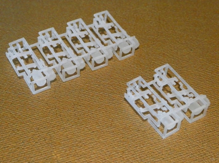 HO KD (Split K Brake) Air Brake System Kit 3d printed This image shows how our KD brake systems look when delivered.  In front is the "small" size with two sprues; in back is the "large" size with four sprues.  Both sizes are printed in SFDP.