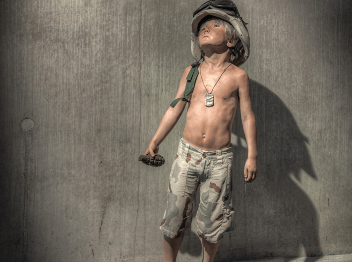 Schoony - Boy Soldier (28mm Tall) 3d printed This Boy Solider has been seen all around the world and now you can get your own.