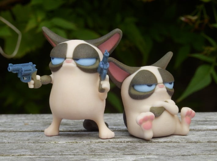 Don't Get Grumpy... Get Even! 3d printed Please note- you only get the cat on the left with guns with this order. The seated cat can be bought seperately