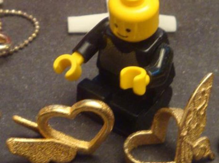 Sheryl heart trinket version 1 - single 3d printed Here is an image of the print next to a Lego man!