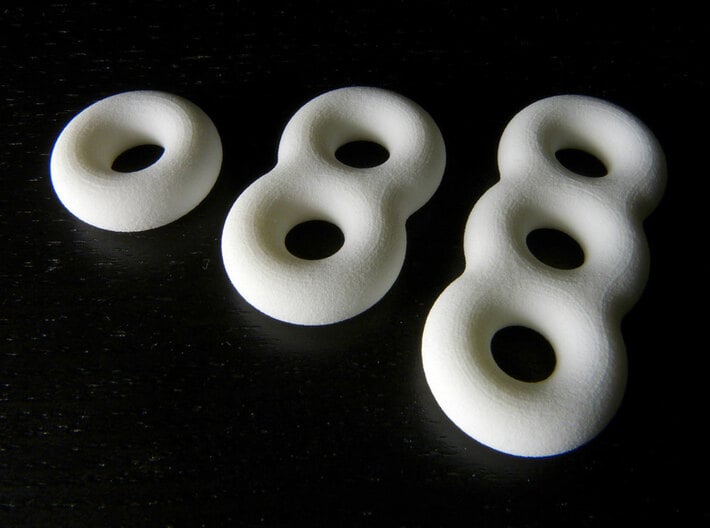 Surfaces of genus one, two and three 3d printed 