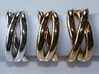 Three Phase Puzzle Ring 3d printed Interlocking Silver, Bronze, and Brass in the solved state.