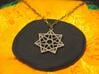 Double Heptagram Pendant 3d printed Photo of Stainless Steel pendant on a chain.