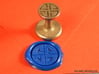 Shield Knot Wax Seal 3d printed Same as the first one, with Royal Blue wax on an orange envelope.