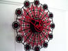 Kaleidoscope Clock - Part B 3d printed The completed Kaleidoscope Clock with Part A in Black Strong & Flexible and Part B in Red Strong & Flexible.This is a two-part clock face kit. This model is Part B. The first part is available at http://www.shapeways.com/model/580491
