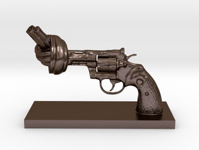 No-violence gun - Antiques in Polished Bronze Steel