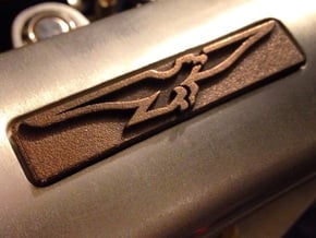DeTomaso Badge RH - steel in Natural Bronze