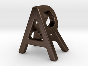 AR RA - Two way letter pendant in Polished Bronze Steel