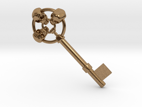 Three skulls key in Natural Brass