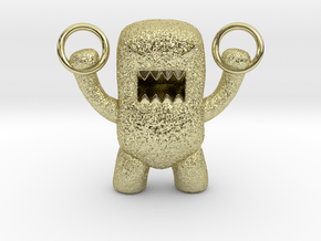 Domo Monster doing exercises with rings in 18k Gold Plated Brass