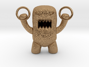 Domo Monster doing exercises with rings in Polished Brass