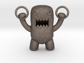 Domo Monster doing exercises with rings in Polished Bronzed Silver Steel