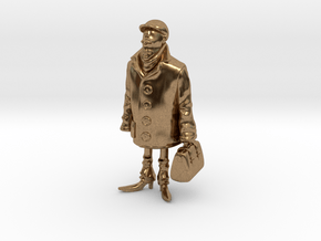 Man holding a suitcase in Natural Brass