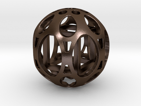 Sphere housing a cube in Polished Bronze Steel