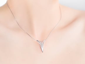 YOUNIVERSAL FIGURA Pendant. Sculpted Chic in Rhodium Plated Brass