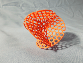Enneper surface irregular holes weave in Orange Processed Versatile Plastic