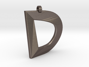 Distorted Letter D in Polished Bronzed Silver Steel