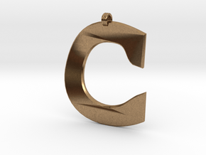 Distorted letter C in Natural Brass
