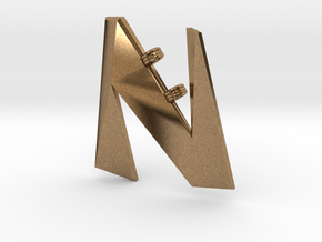 Distorted letter N in Natural Brass