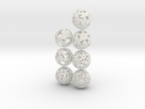 Comma symmetry spheres: 7 infinite families in White Natural Versatile Plastic