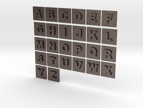 latin alphabet letters puzzle pieces in Polished Bronzed Silver Steel