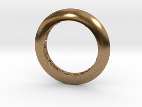 Ring shaped pendant with a raw band inside in Natural Brass