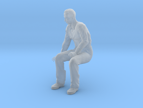 NG Fred sitting on bench looking down in Clear Ultra Fine Detail Plastic