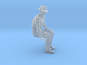 1-24 Fred sitting on bench wearing hat in Clear Ultra Fine Detail Plastic