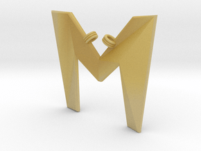 Distorted letter M in Tan Fine Detail Plastic