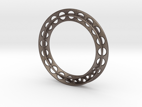 Self-Perforation in Polished Bronzed-Silver Steel