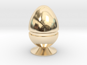 Two part hollow egg shell with foot in 14K Yellow Gold